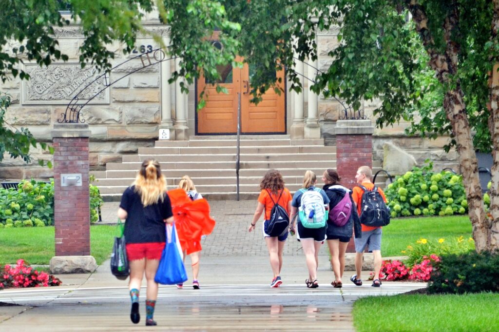 College students on campus on their way to class higher education!